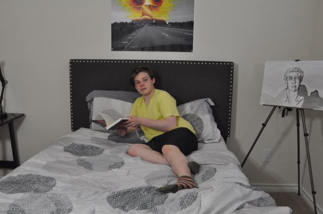 Kameron Badgers working in Jacob's sketchbook for the film Beyond the Bridge