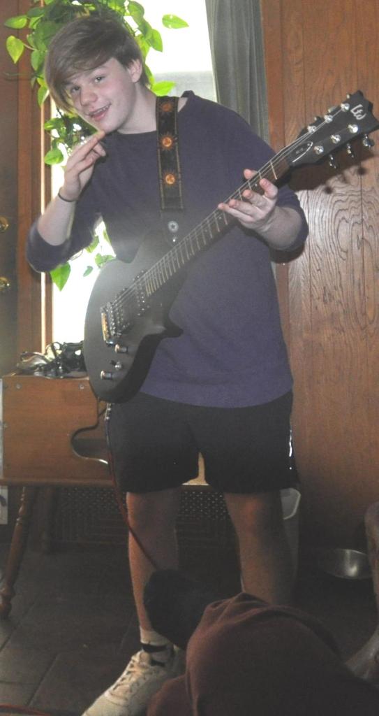 Kameron Badgers playing guitar July 2017