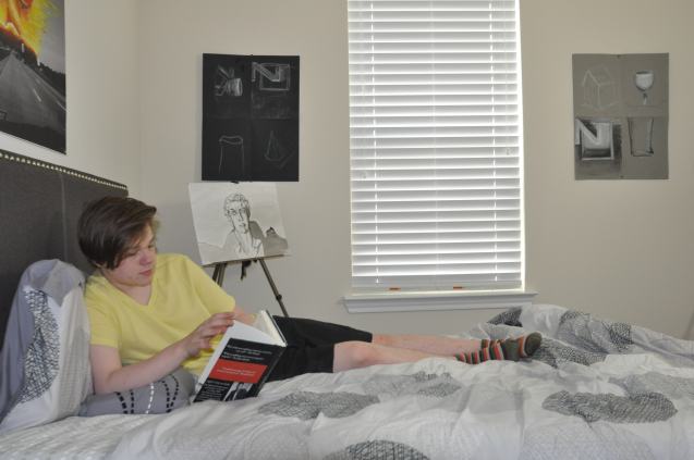 Kameron Badgers working in Jacob's sketchbook for the film Beyond the Bridge